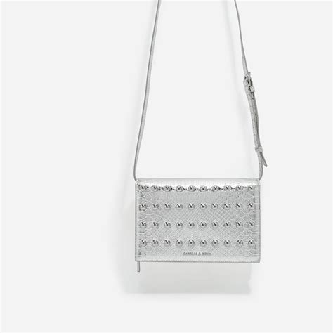 charles and keith silver handbags.